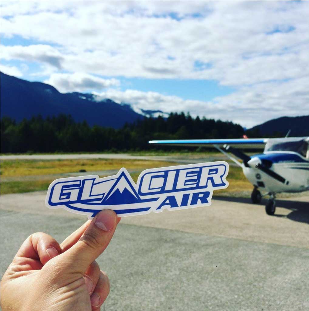 Waterproof custom die cut stickers on laptop and water bottle โ durable vinyl